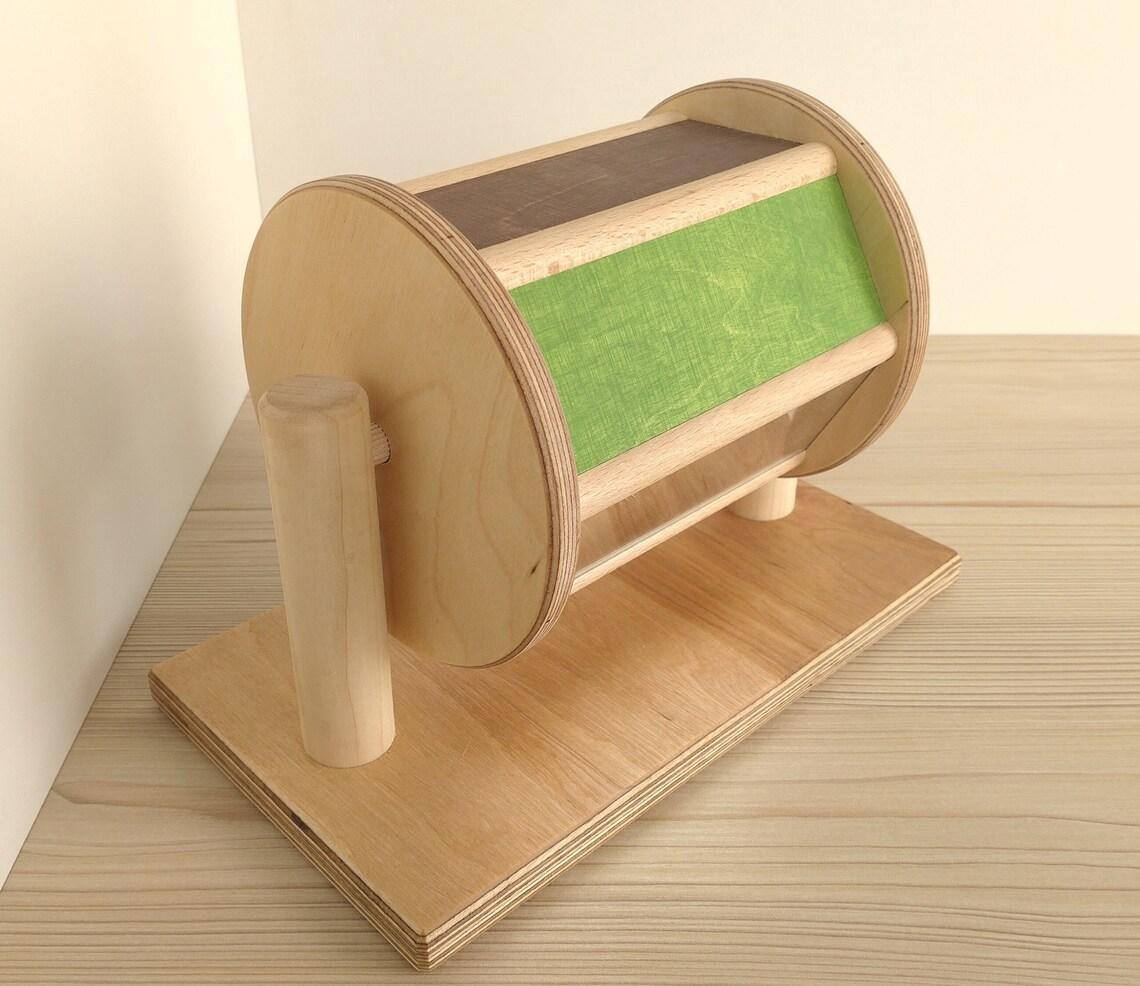 Wooden Montessori spinning drum with mirror and beads